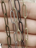 Image of Paperclip Chain Brass Long Skinny Oval Rectangle Paperclip textured Chain 15mm x 5mm x .75 mm  Sold by the foot Electroplated Fast Ship